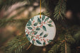 a ceramic ornament hanging from a christmas tree