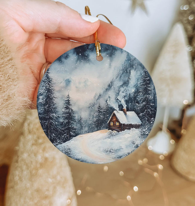 a person holding a christmas ornament in their hand