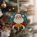 a christmas ornament hanging from a christmas tree