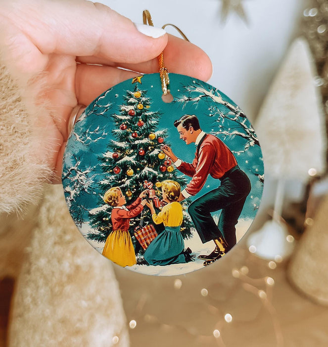 a person holding a christmas ornament in their hand