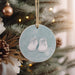 a christmas ornament hanging from a christmas tree