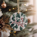 a ceramic ornament hanging from a christmas tree