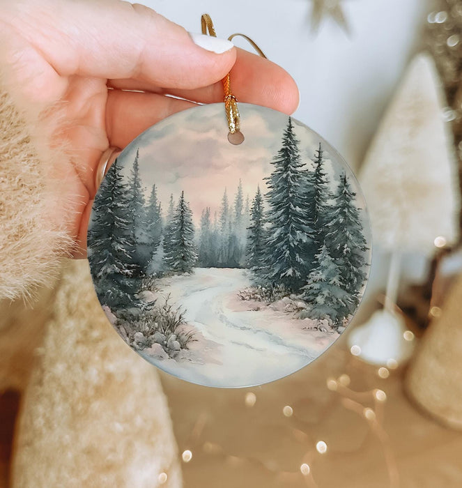 a person holding a christmas ornament in their hand