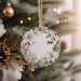 a christmas ornament hanging from a christmas tree