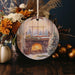 a christmas ornament with a fireplace in the background