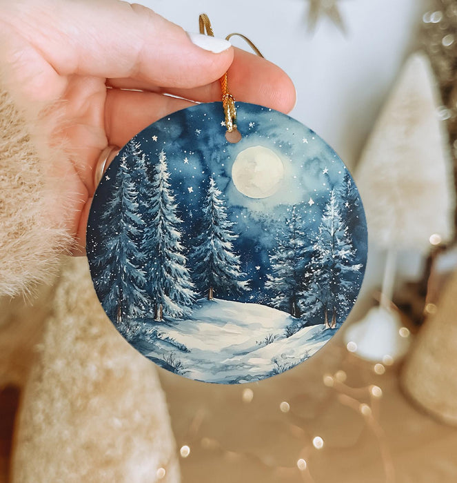 a person holding a christmas ornament in their hand