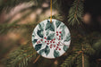 a ceramic ornament hanging from a christmas tree