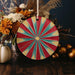 a vase filled with flowers and a red and blue umbrella