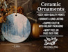 a ceramic ornament with a snowy forest scene