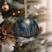 a christmas ornament hanging from a christmas tree