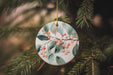 a ceramic ornament hanging from a christmas tree