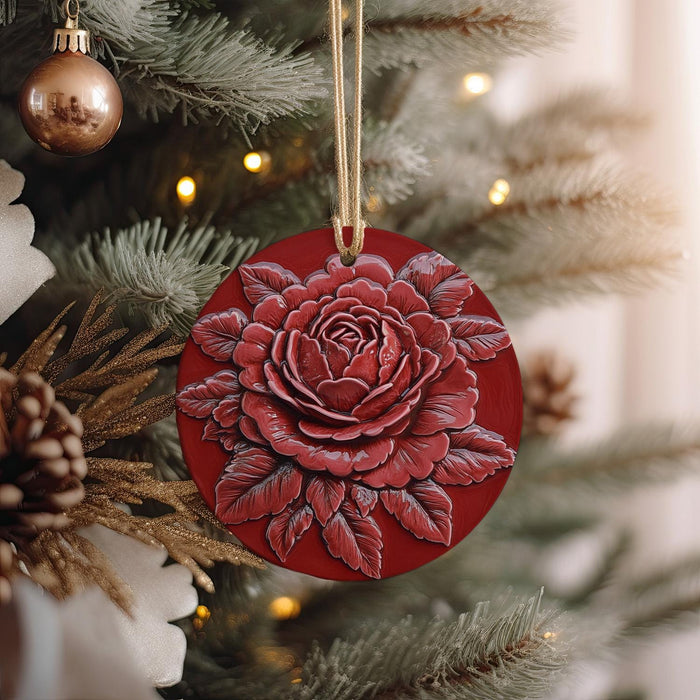 a red ornament hanging from a christmas tree