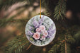 a glass ornament with flowers hanging from a tree