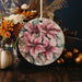 a ceramic ornament decorated with flowers and leaves
