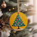 a christmas tree ornament hanging from a christmas tree