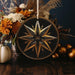 a star ornament sitting on top of a wooden table