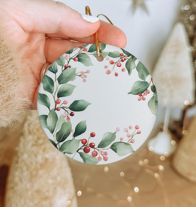 a person holding a christmas ornament in their hand