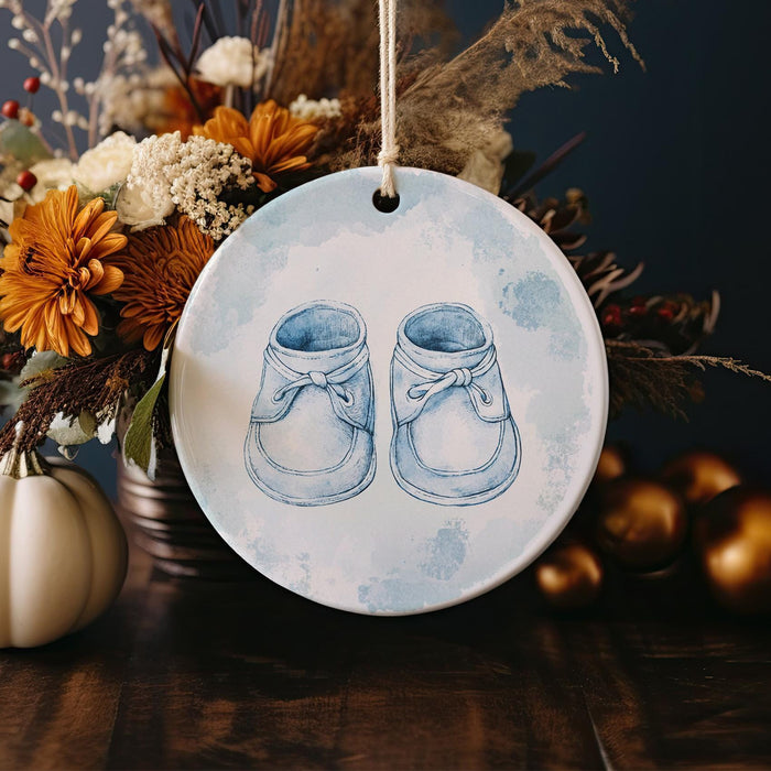 a ceramic ornament with a pair of shoes on it