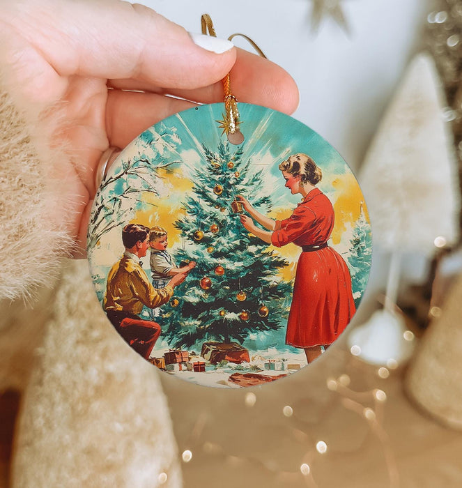 a person holding a christmas ornament in their hand