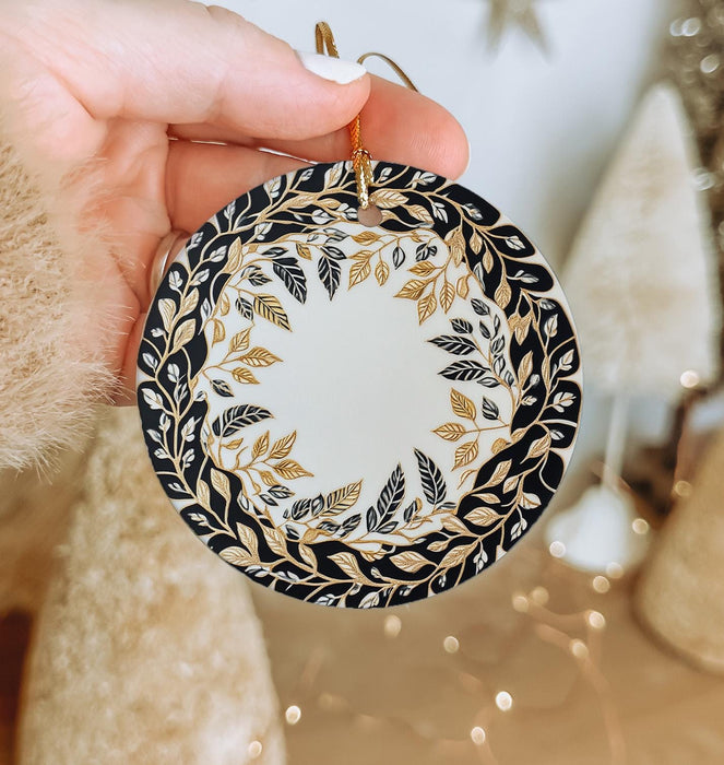 a person holding a christmas ornament in their hand