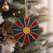 a christmas ornament hanging from a christmas tree