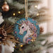 a christmas ornament hanging from a christmas tree