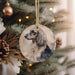 a dog ornament hanging from a christmas tree