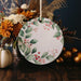 a white plate sitting on top of a wooden table