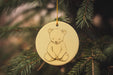 a christmas ornament with a picture of a bear on it