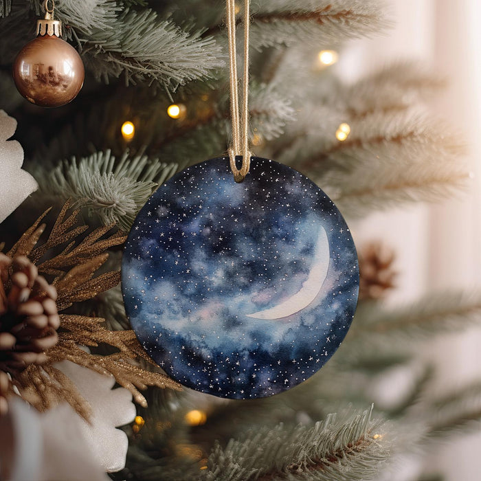 a glass ornament hanging from a christmas tree