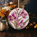 a ceramic ornament decorated with flowers and leaves