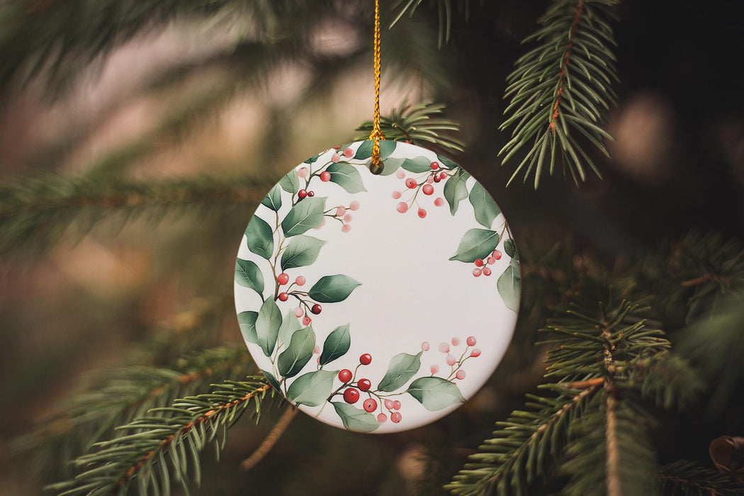 a ceramic ornament hanging from a christmas tree