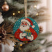 a christmas ornament hanging from a christmas tree