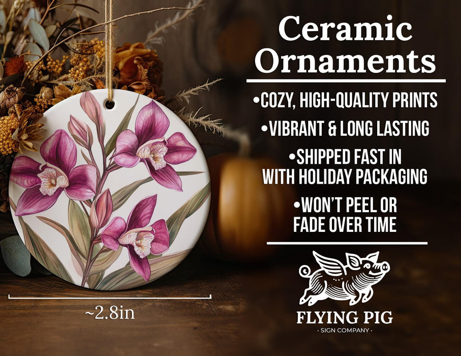 a ceramic ornament with pink flowers on it