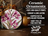 a ceramic ornament with pink flowers on it