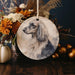 a picture of a dog on a round ornament