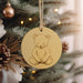 a christmas ornament hanging from a christmas tree