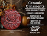 a red ceramic ornament with a rose on it