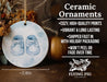 a ceramic ornament with a pair of baby shoes on it