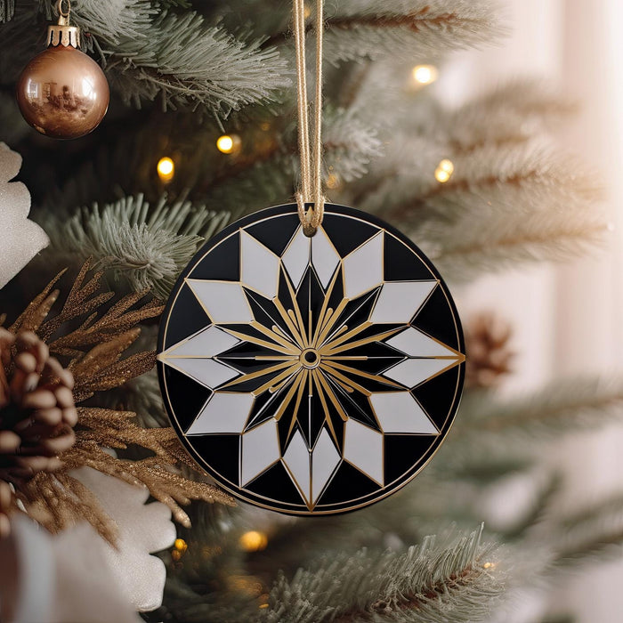 a black and white ornament hanging from a christmas tree