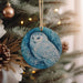 an ornament hanging from a christmas tree