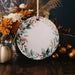 a white plate sitting on top of a wooden table