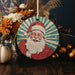 a christmas ornament with a santa clause on it