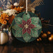 a ceramic ornament with a flower design on it