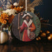 a ceramic ornament with a picture of a man