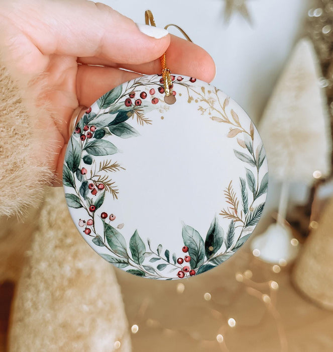 a person holding a christmas ornament in their hand