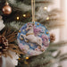 a christmas ornament hanging from a christmas tree