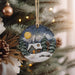 a christmas ornament hanging from a christmas tree