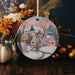 a ceramic ornament with a winter scene on it