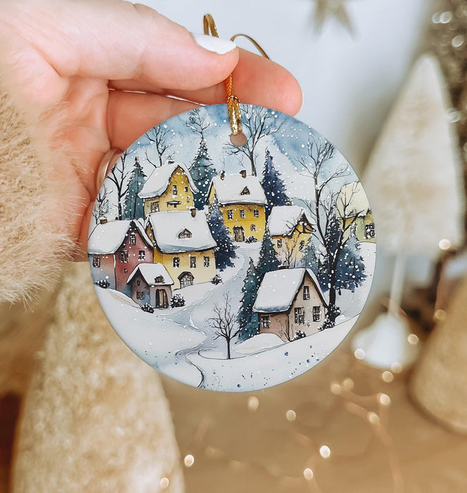 a person holding a christmas ornament in their hand